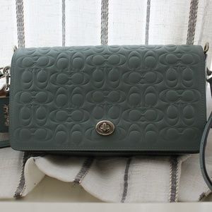 COACH DINKY IN SIGNATURE LEATHER (NEVER USED)